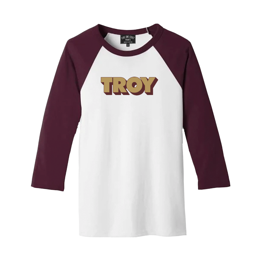 Retro-stylish and comfortable, our "3D Troy" design has been printed on the front of a lightweight raglan tee in white and maroon.  Only Found at 518 Prints