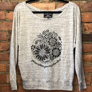 Grow where you're planted - and show off your resilient spirit in our comfortable flowy long sleeve. Custom design, printed in black on the front of a white marble colored shirt.  Only found at 518 Prints