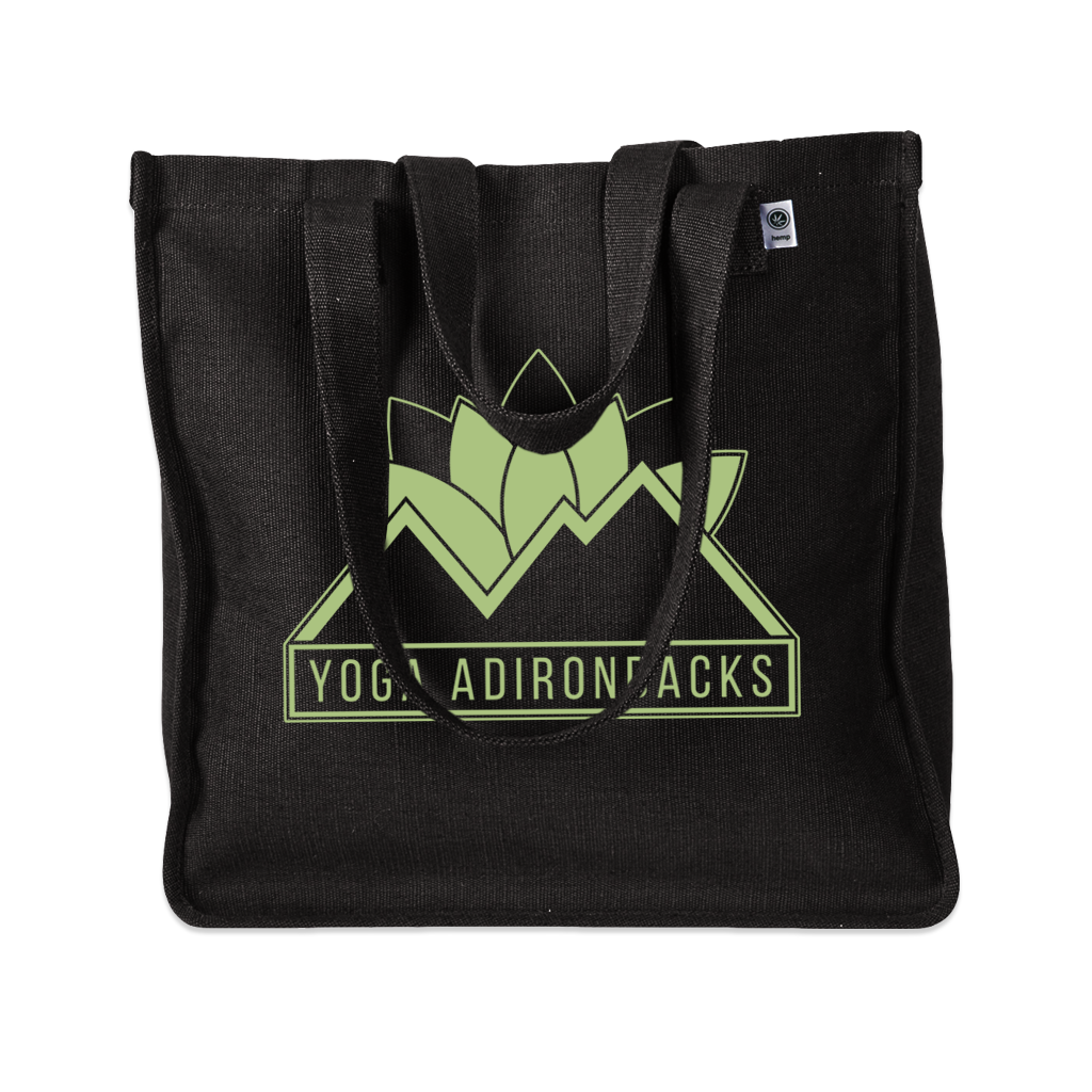 Yoga Adirondacks' lotus mountain logo, printed on the side of a sturdy woven hemp tote bag. Available in Black and Olive.