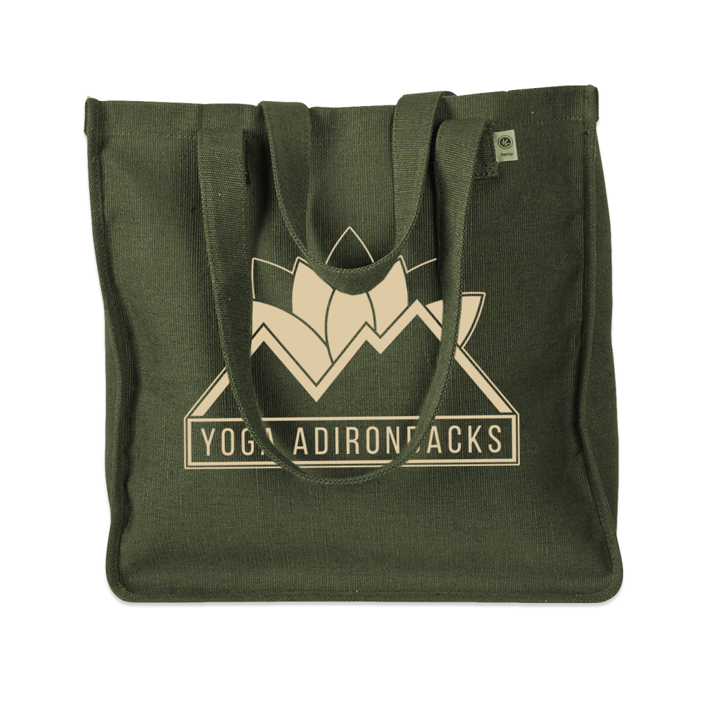 Yoga Adirondacks' lotus mountain logo, printed on the side of a sturdy woven hemp tote bag. Available in Black and Olive.