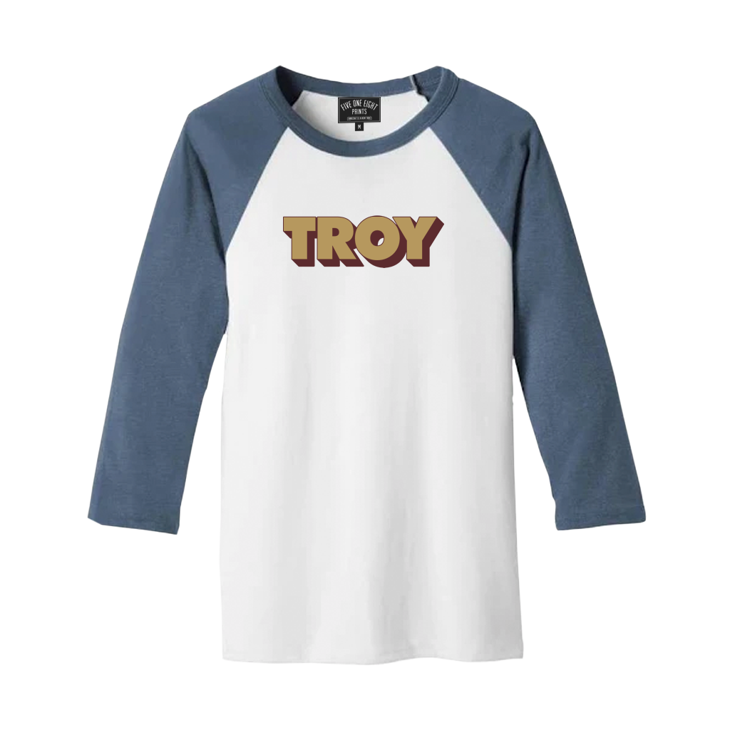 Retro-stylish and comfortable, our "3D Troy" design has been printed on the front of a lightweight raglan tee in white and denim.  Only Found at 518 Prints