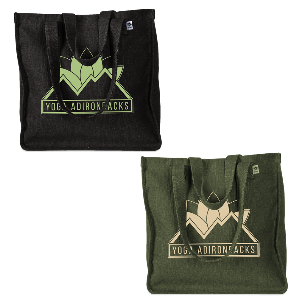 Yoga Adirondacks' lotus mountain logo, printed on the side of a sturdy woven hemp tote bag. Available in Black and Olive.