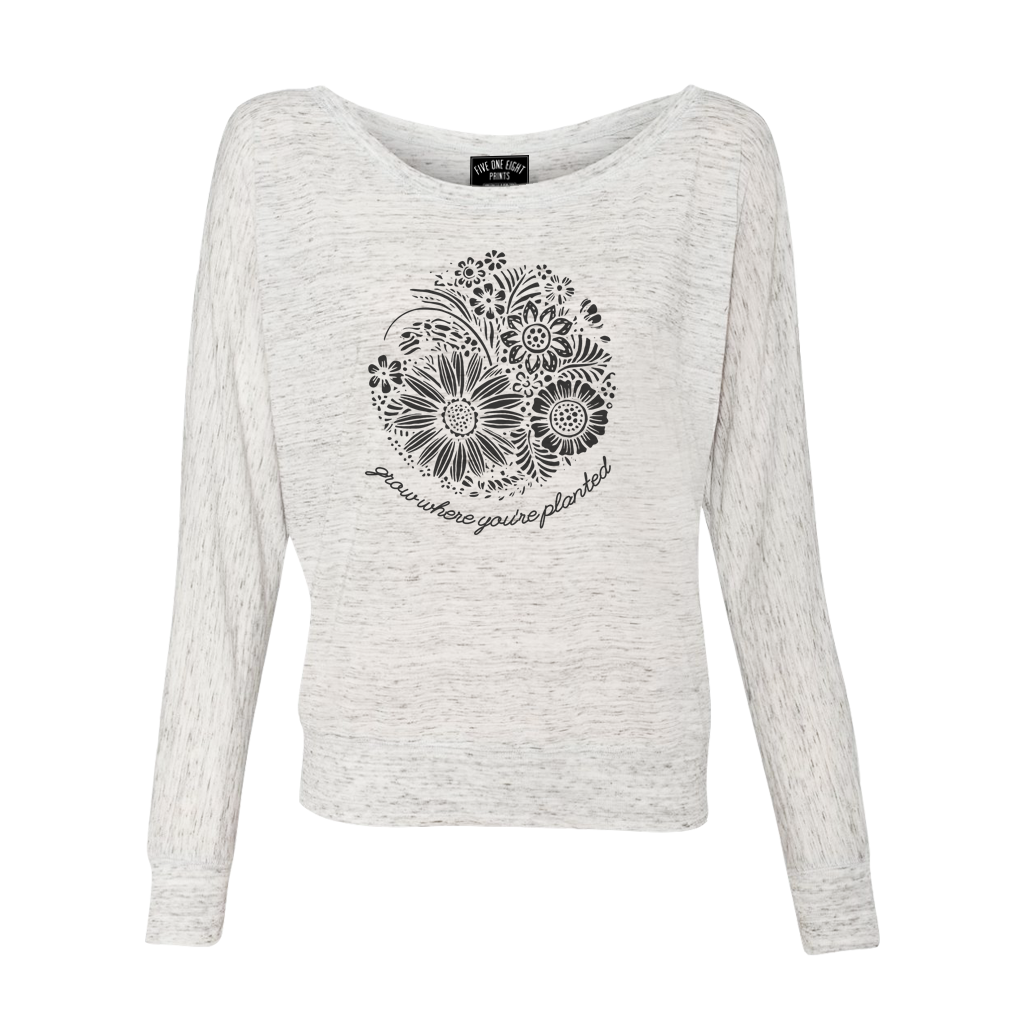 Grow where you're planted - and show off your resilient spirit in our comfortable flowy long sleeve. Custom design, printed in black on the front of a white marble colored shirt.  Only found at 518 Prints