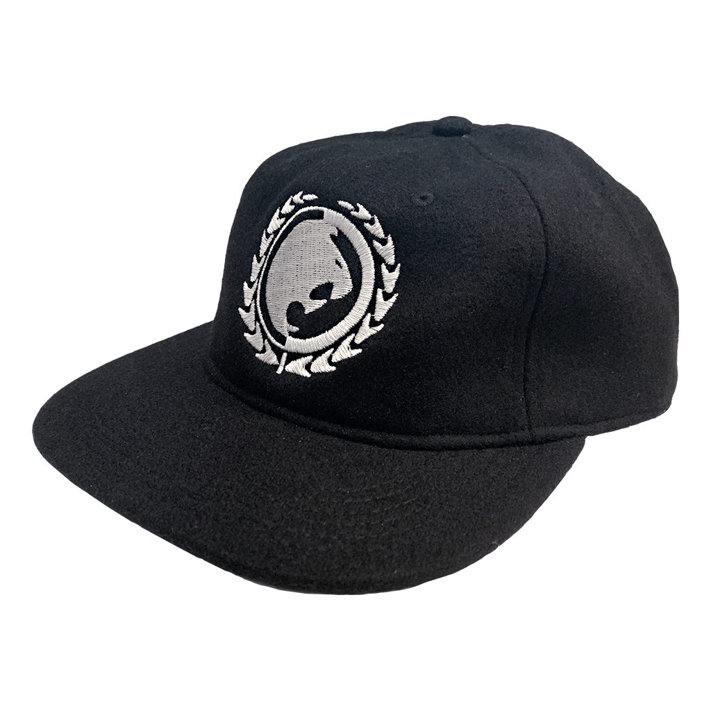 Renzo Gracie Latham's lion head design, embroidered on the front of a black AS Colour hat.  Cap features: lower profile, unstructured six-panel; adjustable fastener with metal clasp and tonal under-peak lining; mid-weight; flat peak; 50% wool/50% polyester fabric. One size fits all.