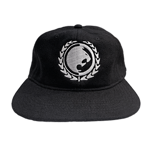Renzo Gracie Latham's lion head design, embroidered on the front of a black AS Colour hat.  Cap features: lower profile, unstructured six-panel; adjustable fastener with metal clasp and tonal under-peak lining; mid-weight; flat peak; 50% wool/50% polyester fabric. One size fits all.